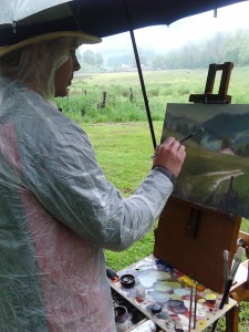 Jeremy plein air painting in the rain