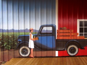 Lenoir County farmer's market mural, Kinston NC. Close up of lady carrying vegetables with early model Ford truck by North Carolina artist, Jeremy Sams